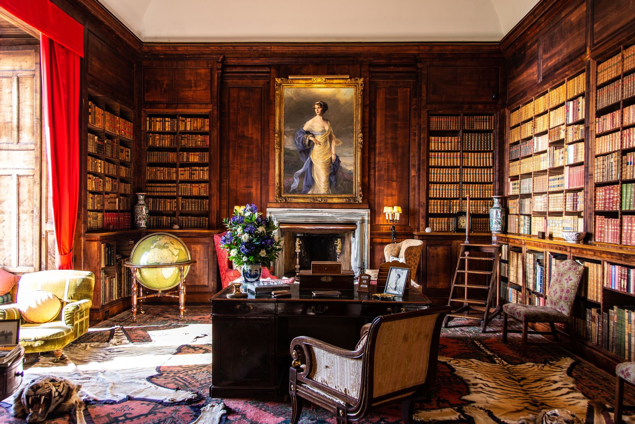 Image of George Stephenson's office with desk, chairs, books and paintings